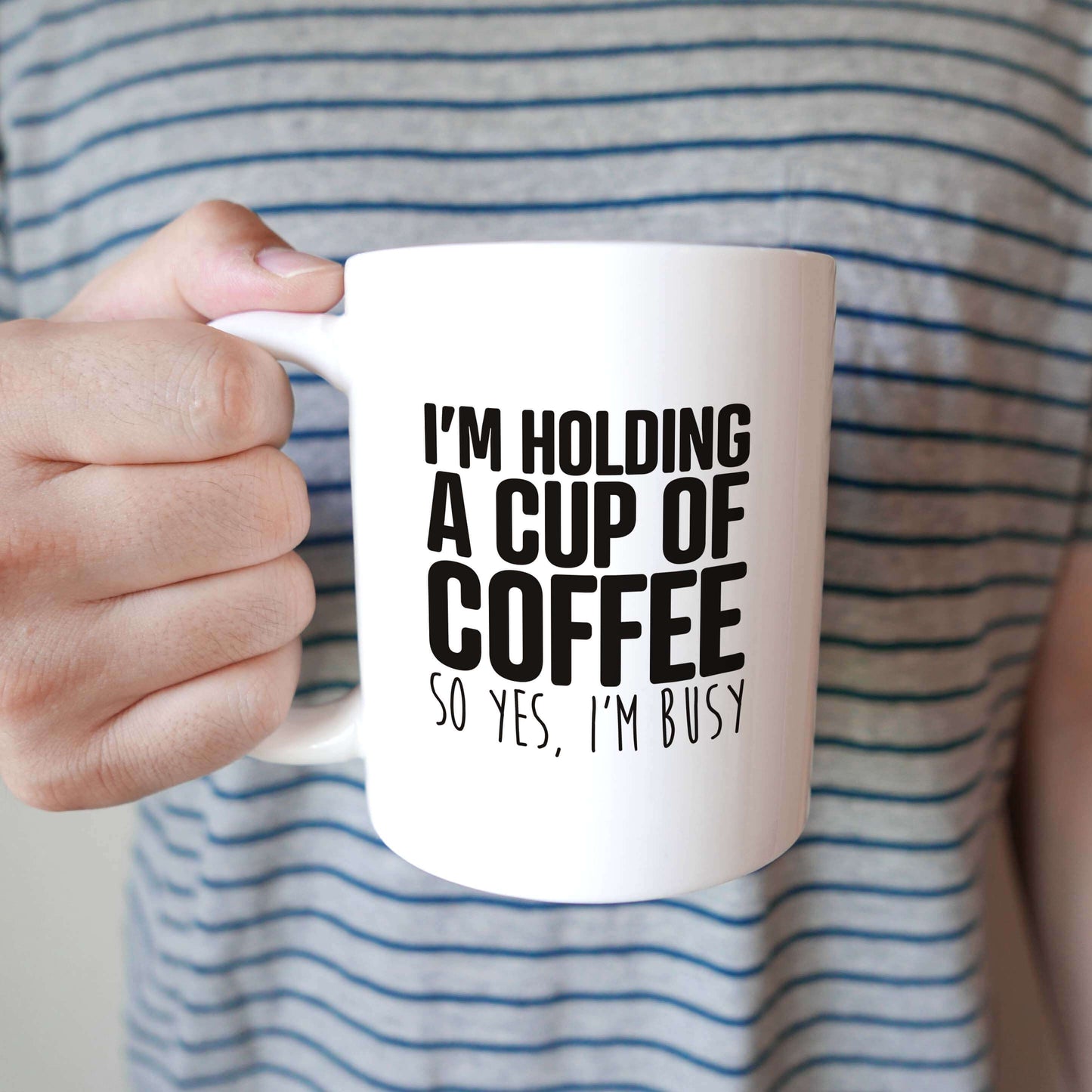 I'm holding A cup of coffee Mug
