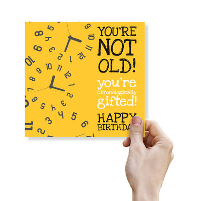 You’re Not Old – Chronologically Gifted" Yellow Clock Birthday Card