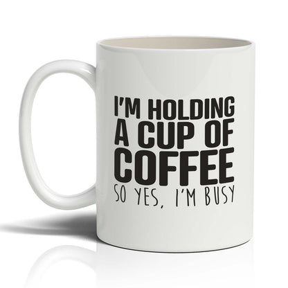 I'm holding A cup of coffee Mug