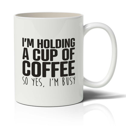 I'm holding A cup of coffee Mug